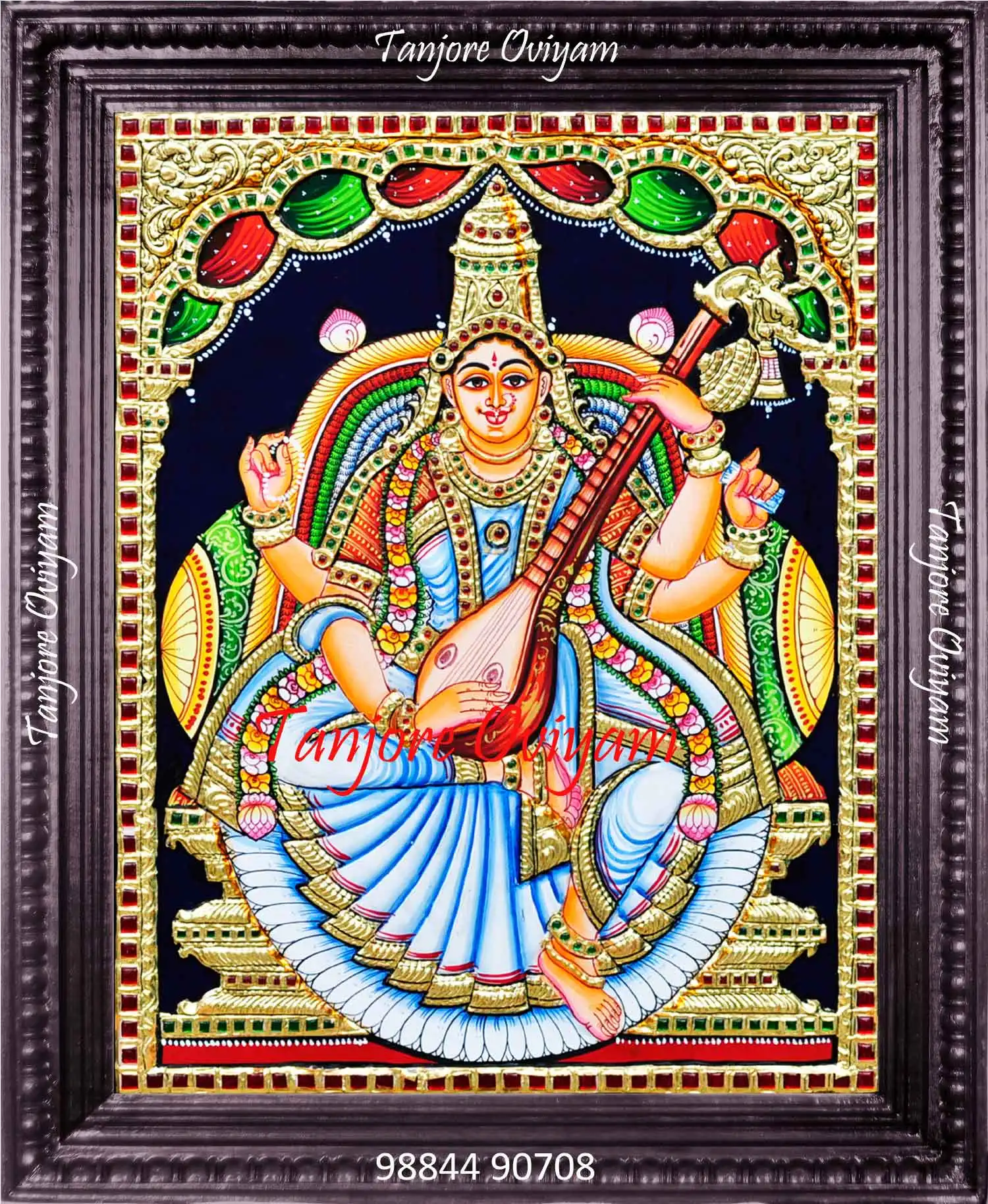 Hand-painted Saraswathi Tanjore painting with veena, gold foil and traditional arch detailing